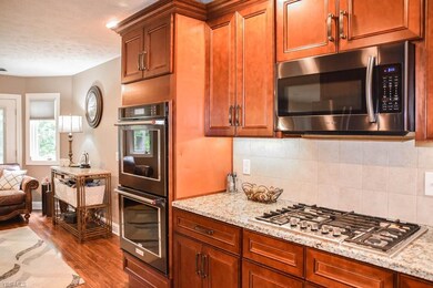 The kitchen has stainless steel appliances.