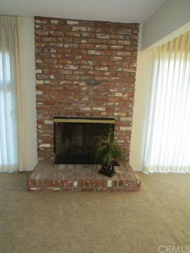 Fireplace elegantly flanked by sliding glass doors