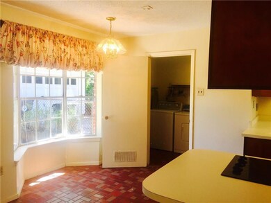 Cheerful breakfast area.  Note the laundry room wi