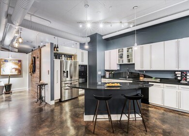 Kitchen featuring black appliances, dark countert