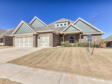 Craftsman-style house featuring concrete driveway, a shingled roof, an attached garage, a front yard, and brick siding