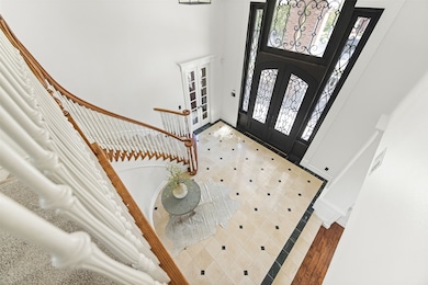 Soaring ceilings and the gorgeous sweeping staircase greet you home with elegance and comfort.