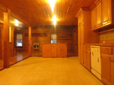 View from kitchen into the living room.  The islan