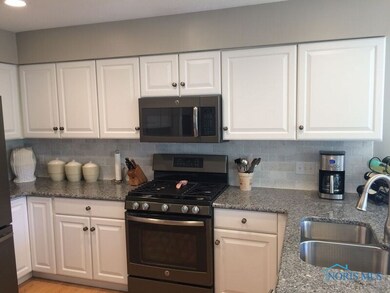 Tumbled marble backsplash.