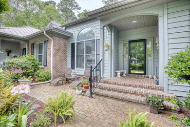 Entrance to property with a patio