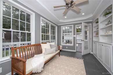 Sunroom / solarium with a tray ceiling
