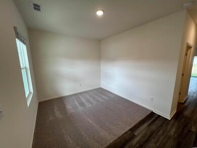 Unfurnished room featuring a wealth of natural lig
