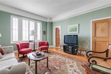 Family room/guest bedroom with wood flooring and p