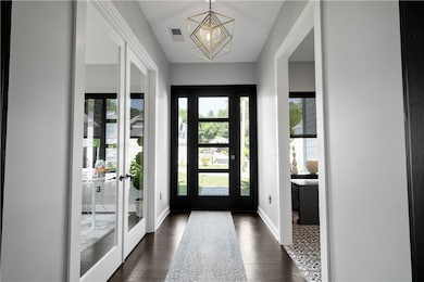 Entry is inviting, warm, and well-lit, creating a welcoming atmosphere for guests.