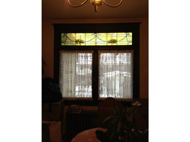 Dining Room. Original stained glass above windows 