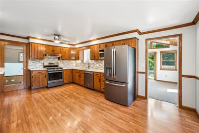 Updated eat in kitchen opening to sun room.
