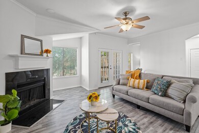 Living Room with wood burning fireplace & lake vie