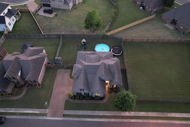 Aerial overview of property's location with nearby suburban area