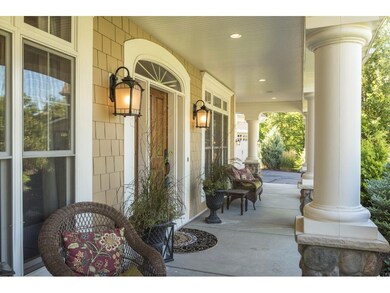 The expansive front porch features built-in speake