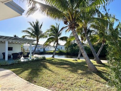 View of yard with a water view and a pergola