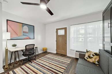 Office space featuring wood finished floors, a ce