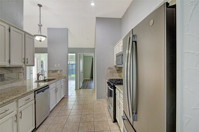 The kitchen features beautiful granite counters, s