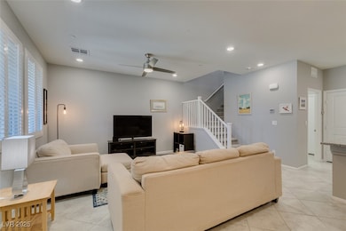 Living room featuring light tile patterned floors,