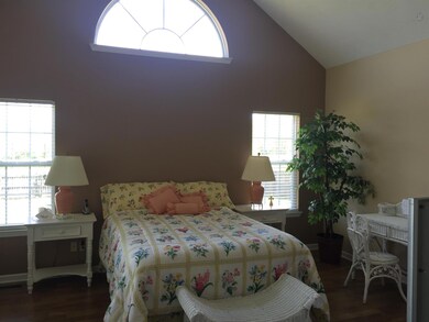 Master bed, with cathedral ceiling, lots of windows to capture the natural lighting