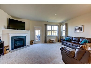 Cozy gas fireplace and French door to the deck.