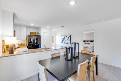 Dining space featuring light wood-style floors and recessed lighting