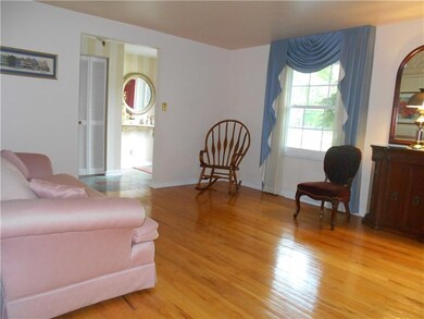 Another view of living with view of spacious entry