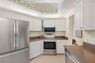 Kitchen featuring light tile patterned flooring, a
