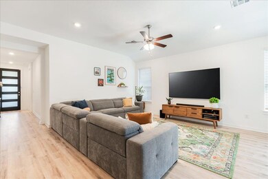 Living room featuring recessed lighting, light wo