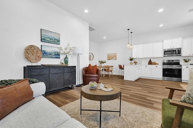 GORGEOUS OPEN FLOOR PLAN! LIVING ROOM VIEW & TWO OPTIONS FOR THE WOOD LAMINATE FLOORING!