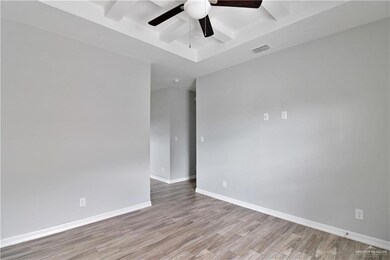 Empty room with light hardwood / wood-style flooring and ceiling fan