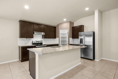 Kitchen with appliances with stainless steel fini