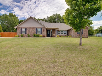 Single story home featuring brick siding