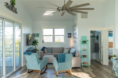 Living area featuring visible vents, wood finished