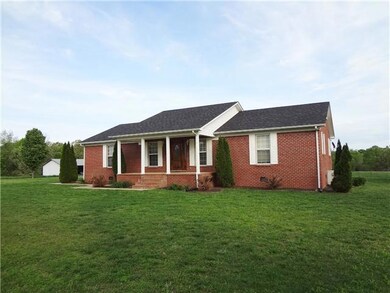 This Wonderful Brick Home offers a 1 year old roof and a great front porch to enjoy the country atmosphere. 
