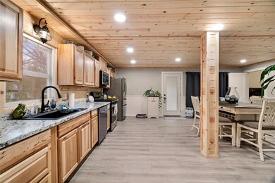 Kitchen featuring stainless steel appliances, ligh