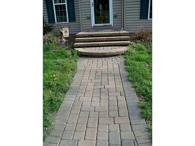 Exterior Front. New Omni Stone Entry