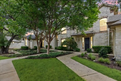 View of front facade with stone siding and a fron