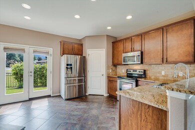 Kitchen with stainless steel appliances, a sink, 
