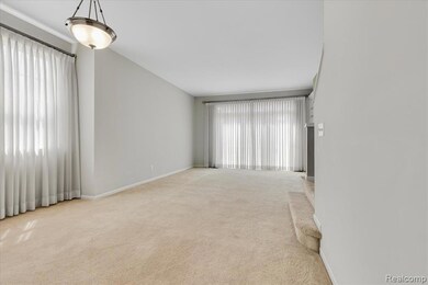 Unfurnished room with plenty of natural light and carpet