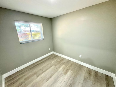 Spare room featuring light hardwood / wood-style f