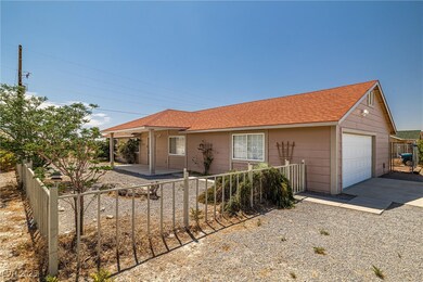 Single story home with roof with shingles, drivewa