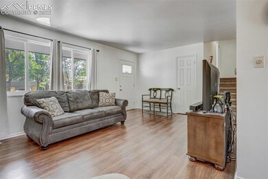 Main level living room with fireplace.