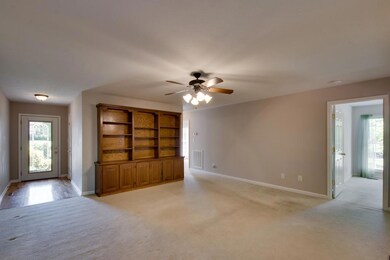 Enter into this over size Family Room with wonderful built in shelving
