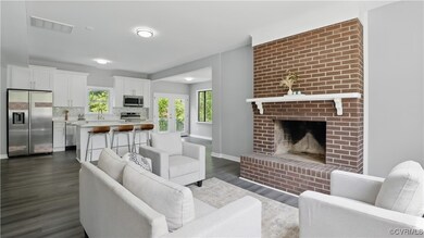 Living room featuring dark wood-type flooring, bas