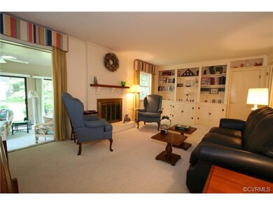 Family room features gas log FP, painted paneling,
