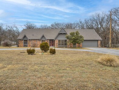View of front of house featuring a garage and a fr