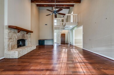 Unfurnished living room with beam ceiling, a stone