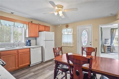 Kitchen featuring brown cabinets, light countertop