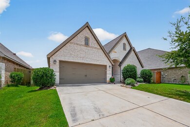 This photo showcases a charming home with a brick
