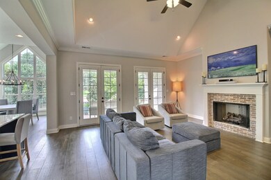 Vaulted room has fireplace with gas logs and is op